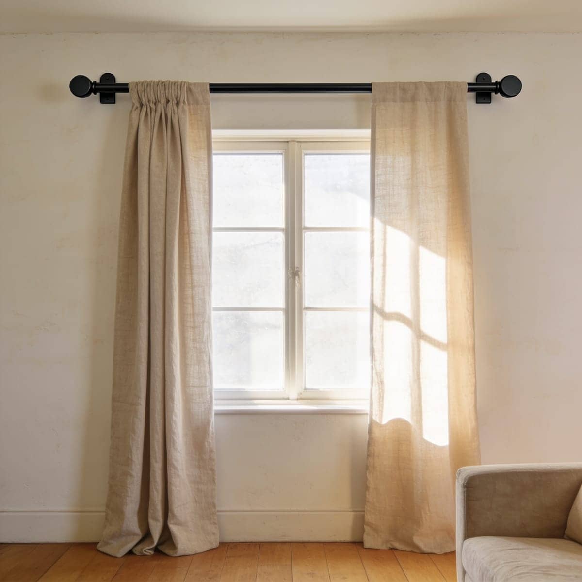 slim matte black curtain rod with small flat cap finials