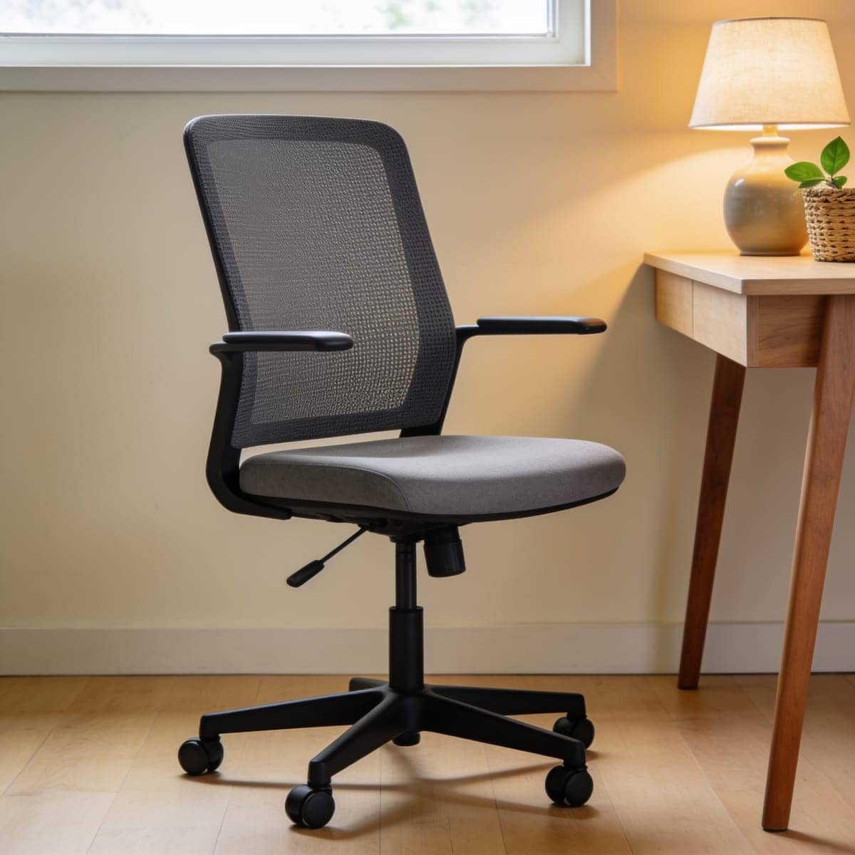 plain black mesh task chair at a simple desk