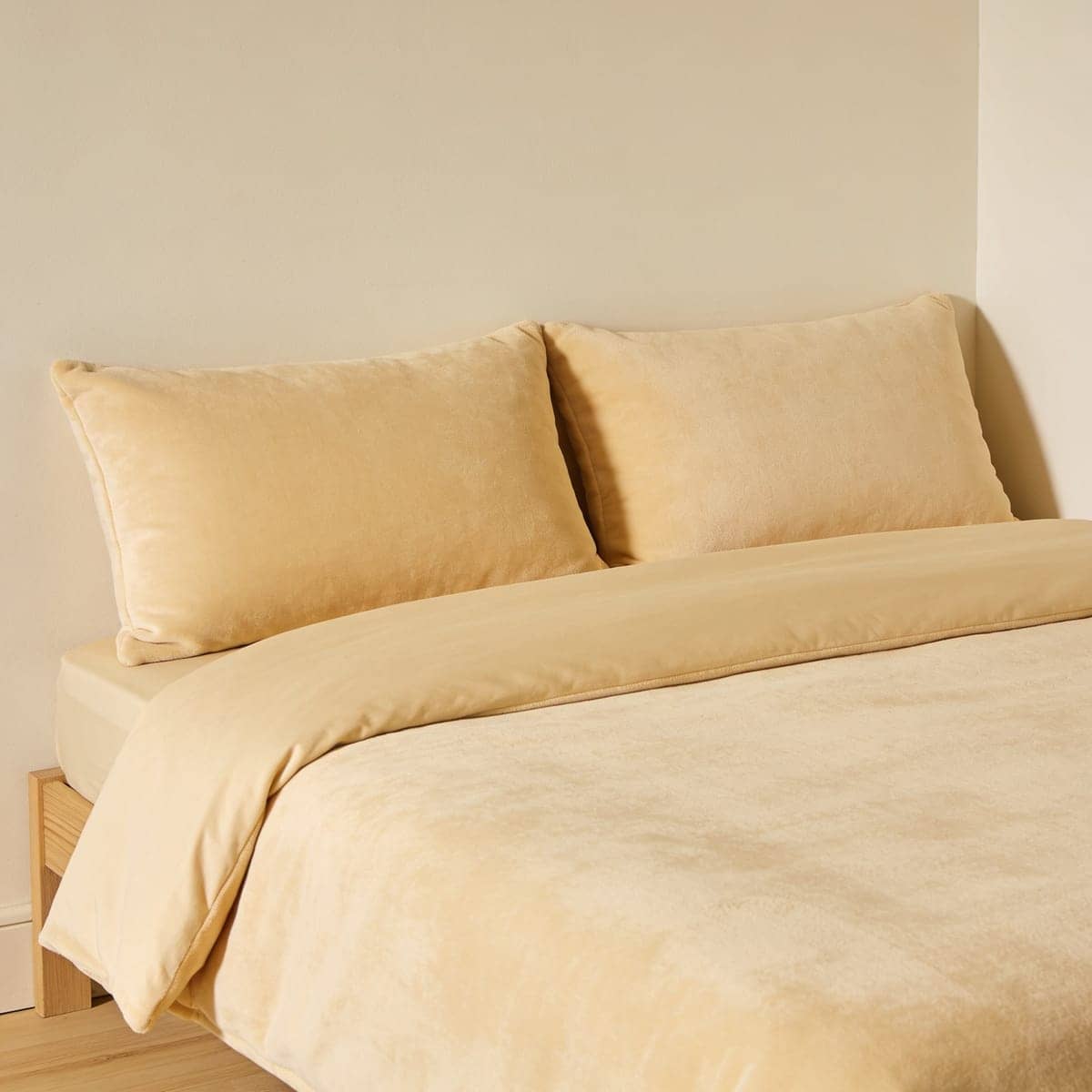 soft cotton comforter set layered on a made bed