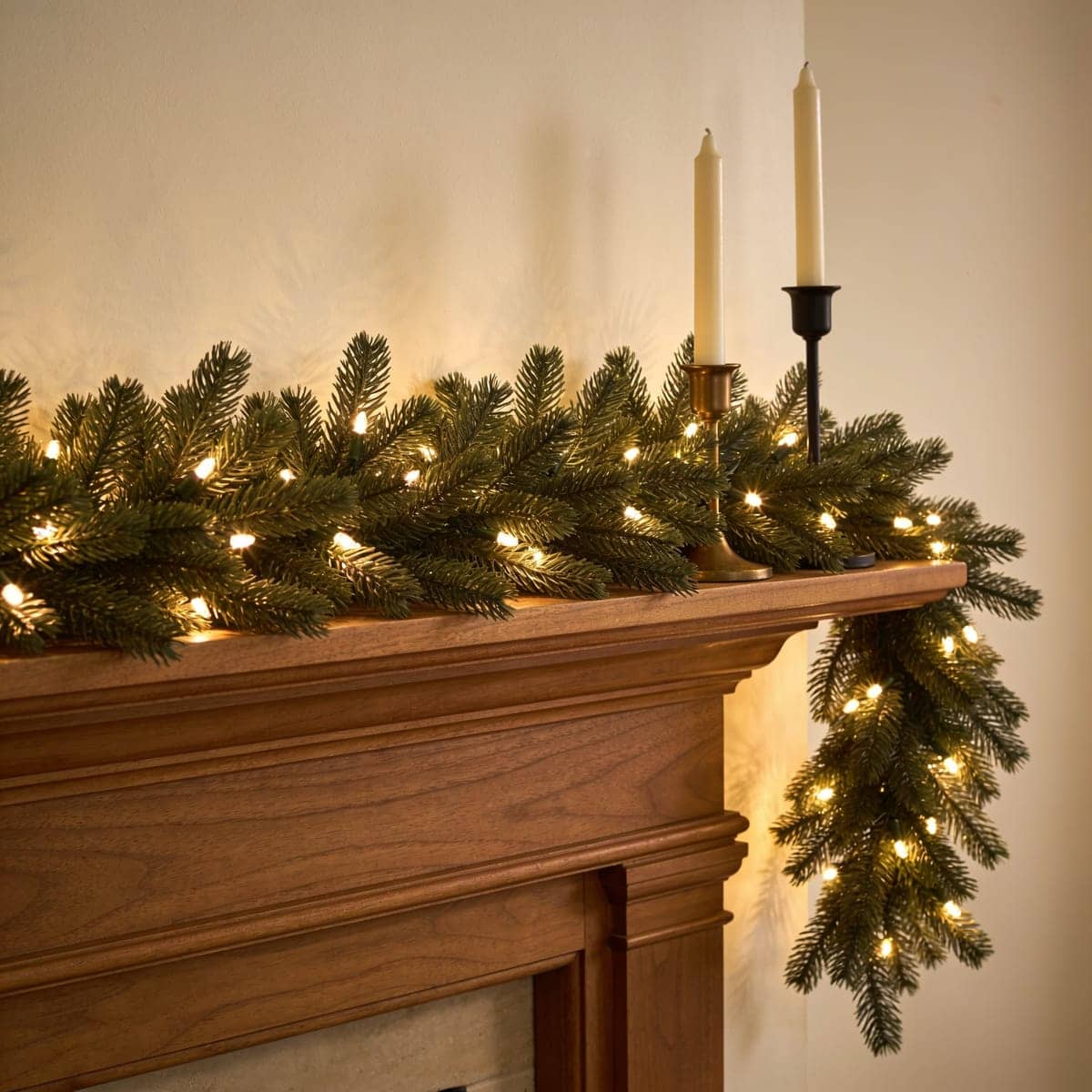 pre-lit pine garland glowing warm white along a mantel