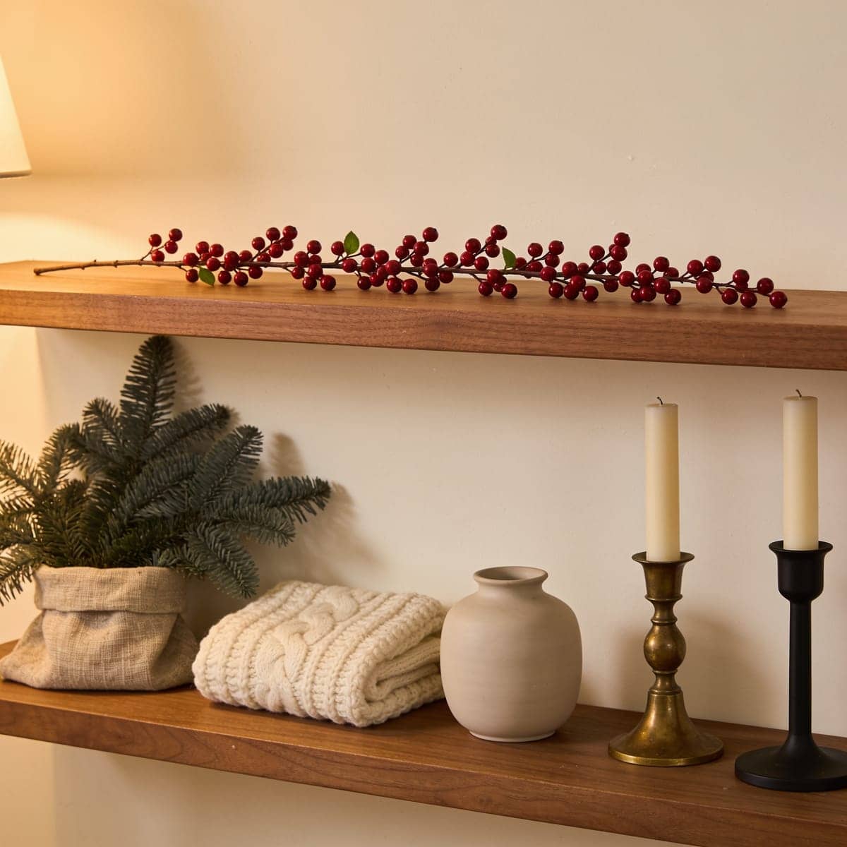 red berry garland woven along a shelf edge