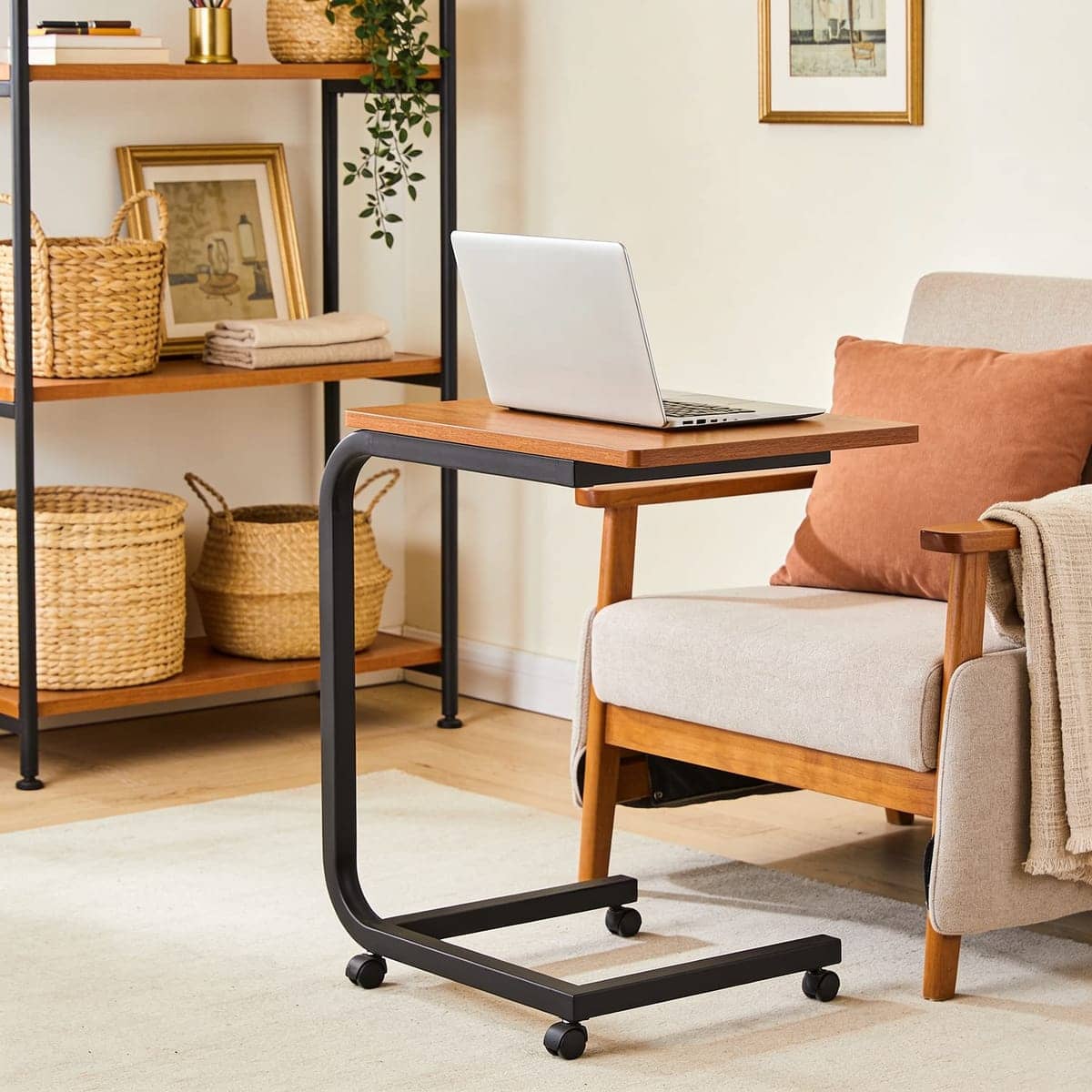 rolling c shaped laptop desk sliding over a sofa
