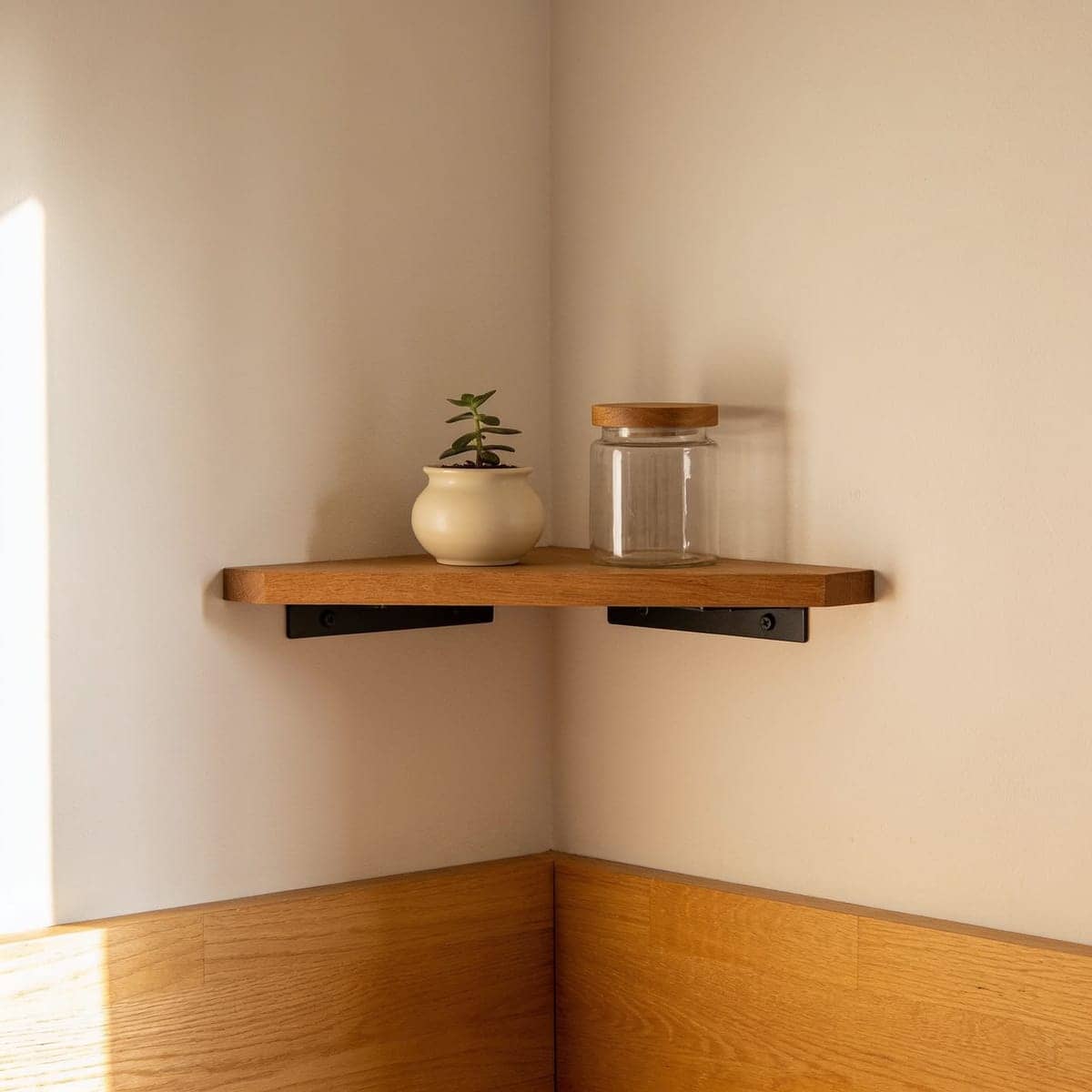 small corner floating shelf mounted in a kitchen corner with two jars