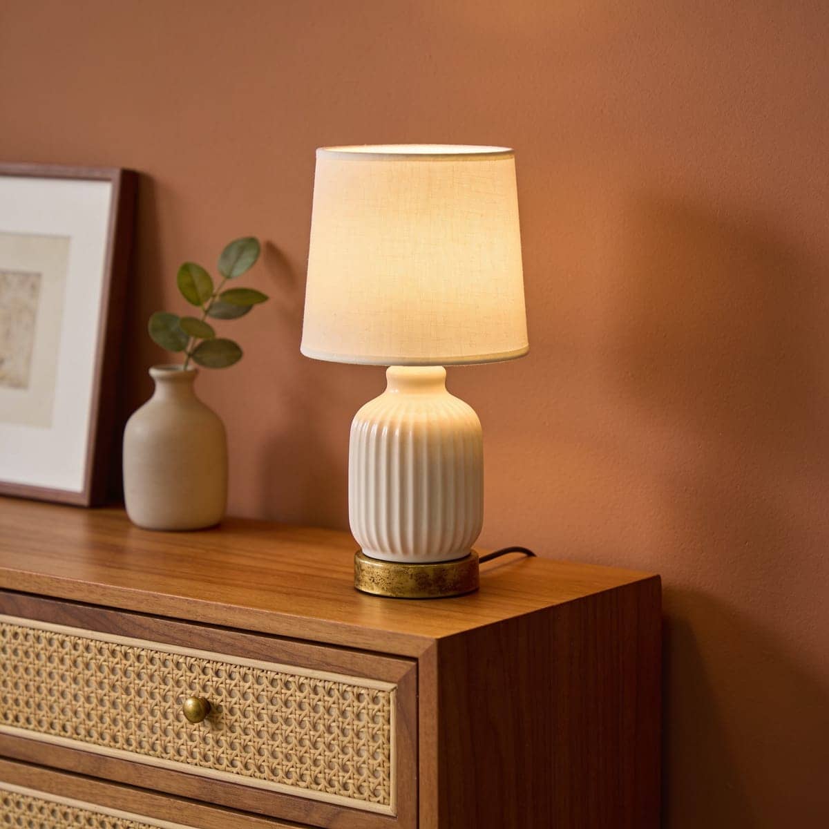 small mini accent lamp on a narrow dresser corner