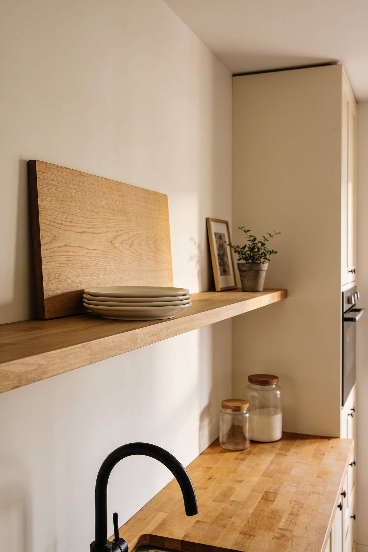 sparse open kitchen shelf with generous empty space at one end