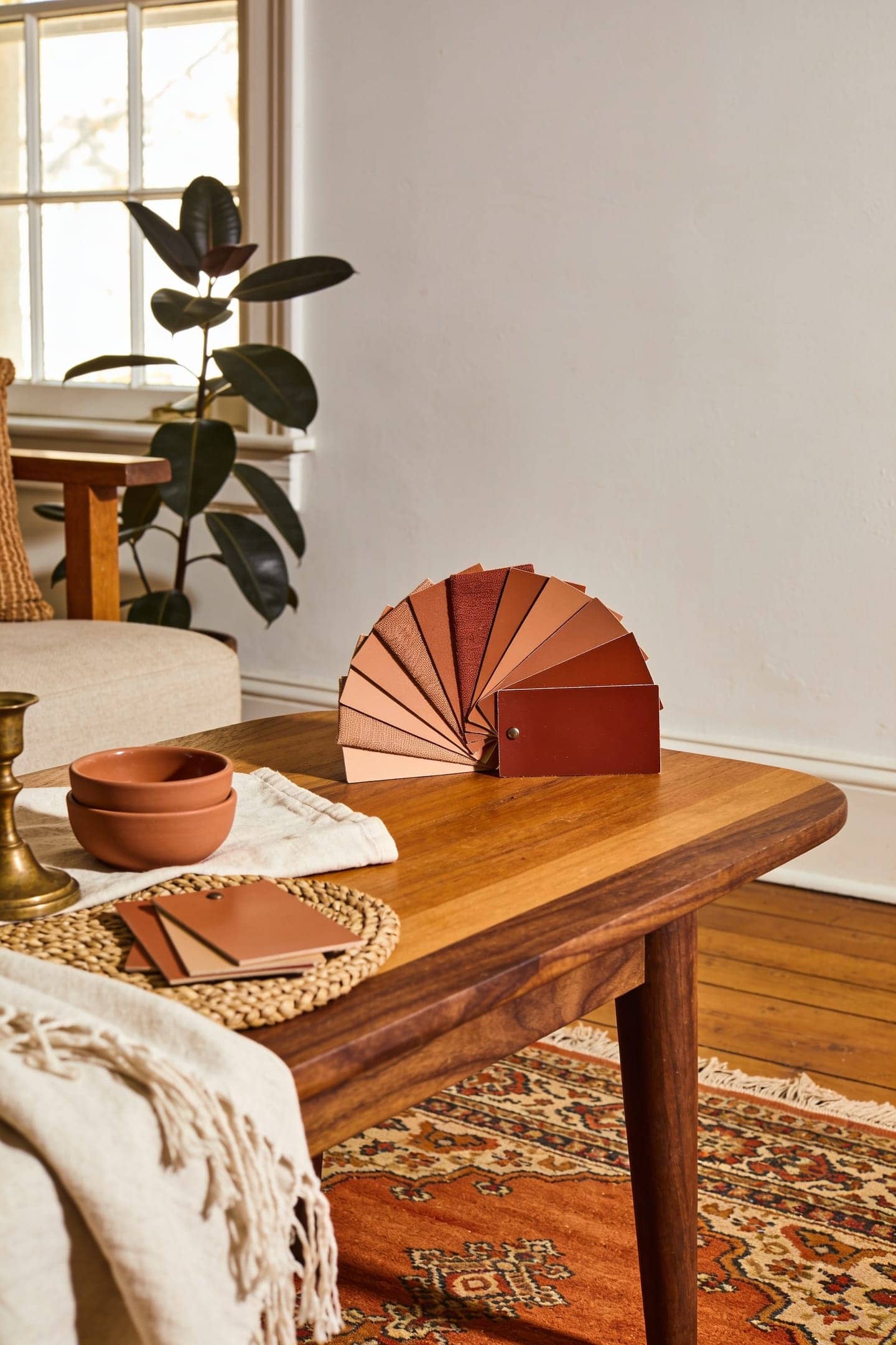 terracotta paint and fabric swatches from pink clay to burnt orange